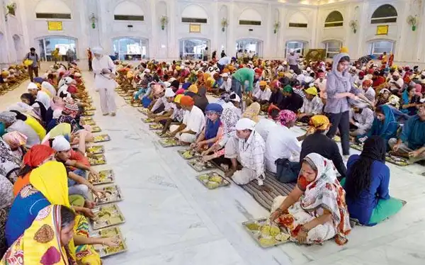 Langar Hall at Gurudwara Bangla Sahib where volunteers serve free meals to visitors