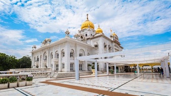 Gurudwara Bangla Sahib golden dome and Sarovar reflection