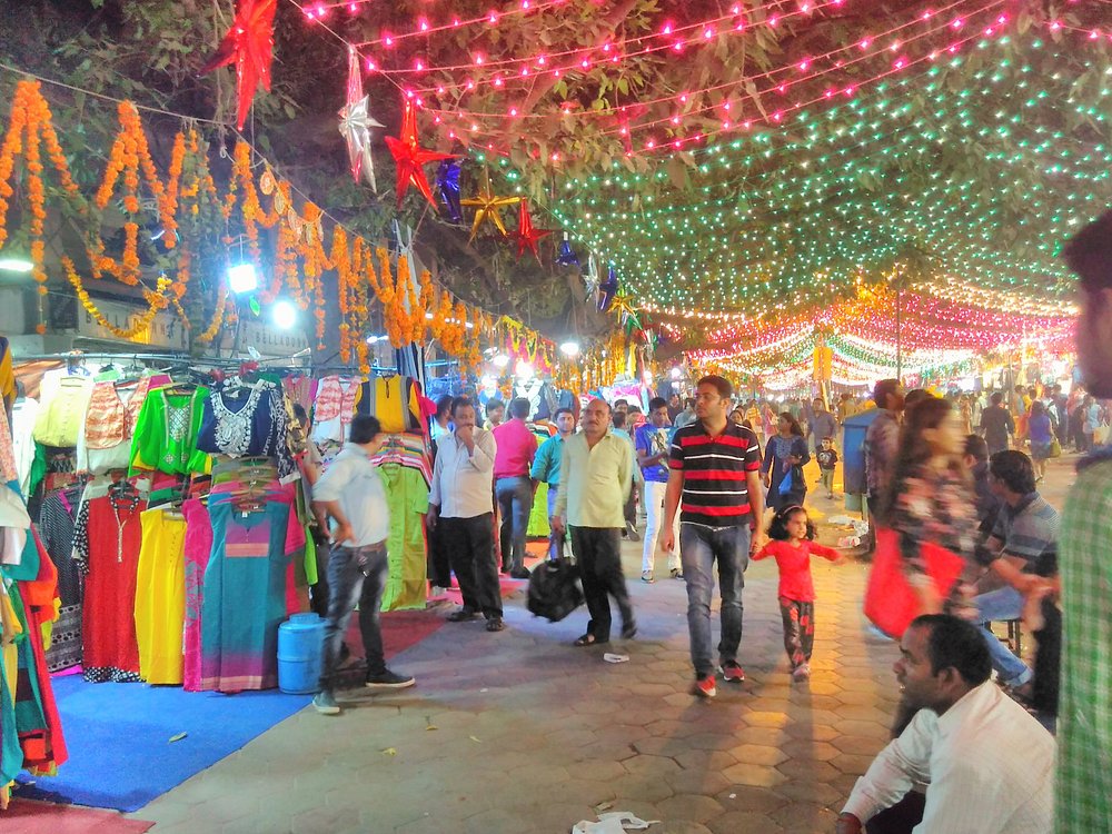 Vibrant Janpath Market street in Delhi with jewelry, textiles and shoppers
