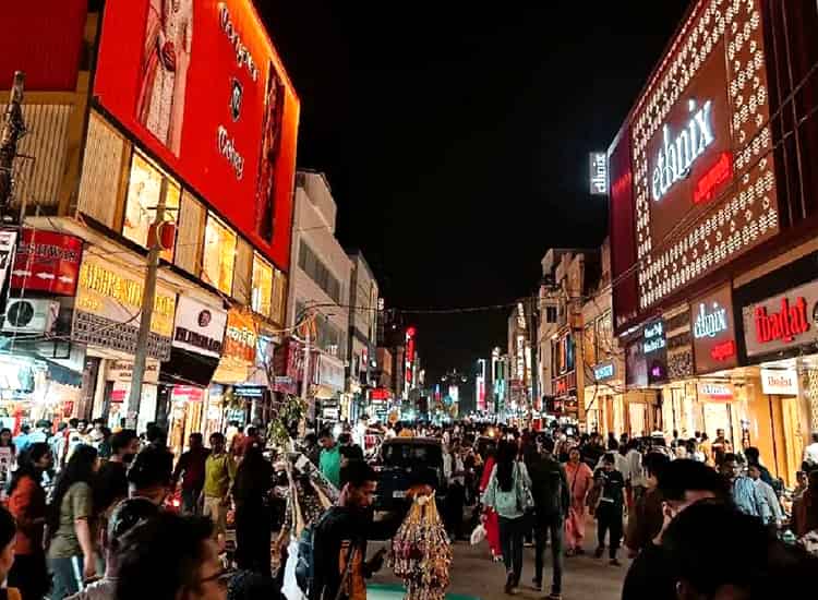 Bustling Karol Bagh Market street with shoppers and stalls