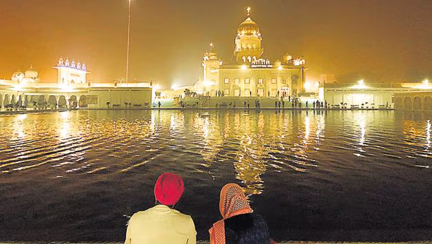 Sarovar at Gurudwara Bangla Sahib reflecting the golden dome and marble structure in Delhi